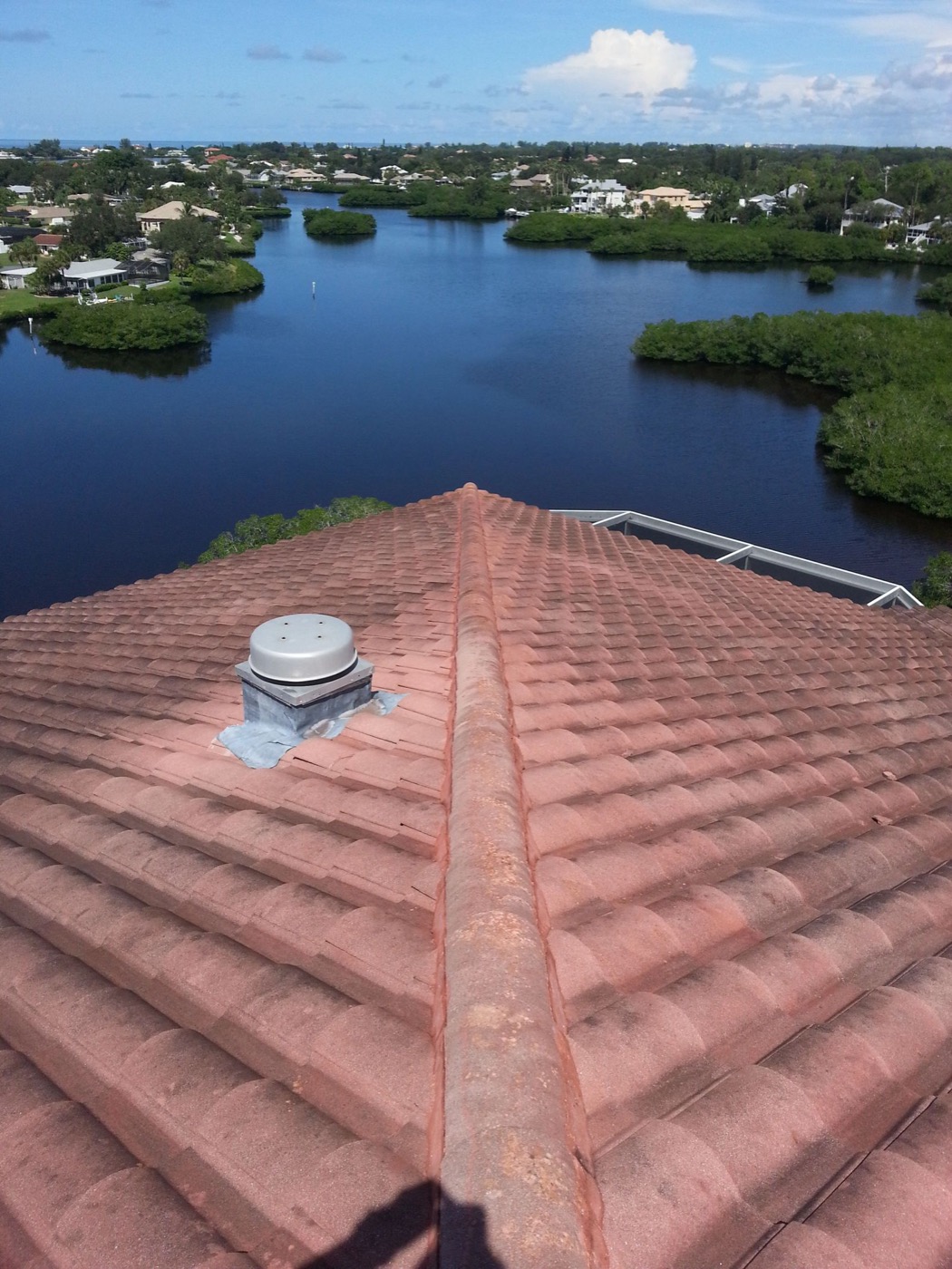 Aerial view of a Florida tile roof overlooking the waterway